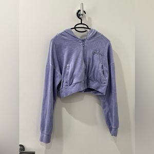 A purple soft, comfortable crop top sweater